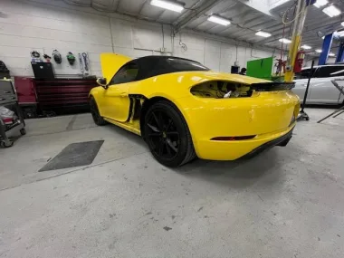Yellow Porsche 718 in the shop